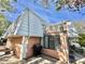 Rear view of condo showcasing private patio and outdoor grill at 4150 S Atlantic Ave # 103A, New Smyrna Beach, FL 32169