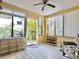 Bright sunroom features tiled floors and plenty of natural light at 4150 S Atlantic Ave # 103A, New Smyrna Beach, FL 32169