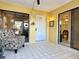 Spacious sunroom offering access to multiple rooms and outdoor views at 4150 S Atlantic Ave # 103A, New Smyrna Beach, FL 32169