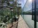 Tennis court with walking path and bench, near lush greenery at 4150 S Atlantic Ave # 103A, New Smyrna Beach, FL 32169