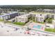 Aerial view of oceanfront condos, pool, and shuffleboard at 4175 S Atlantic Ave # 2150, New Smyrna Beach, FL 32169