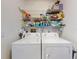 Stackable washer and dryer in a small laundry room at 438 Bouchelle Dr # 104, New Smyrna Beach, FL 32169