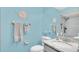 Light blue bathroom with shower and granite vanity at 4411 Sea Mist Ct # 275, New Smyrna Beach, FL 32169