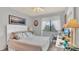 Bright bedroom with a comfortable queen-size bed and ample natural light at 4411 Sea Mist Ct # 275, New Smyrna Beach, FL 32169