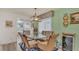 Bright dining area with glass-top table and wicker chairs at 4411 Sea Mist Ct # 275, New Smyrna Beach, FL 32169