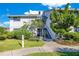 Condo building exterior showcasing entrance and landscaping at 4411 Sea Mist Ct # 275, New Smyrna Beach, FL 32169