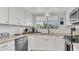 Updated kitchen with white shaker cabinets, granite countertops, and stainless steel appliances at 4411 Sea Mist Ct # 275, New Smyrna Beach, FL 32169