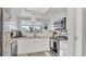 Modern kitchen with white cabinets, granite countertops, and stainless steel appliances at 4411 Sea Mist Ct # 275, New Smyrna Beach, FL 32169