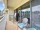 Private balcony with outdoor seating and partial ocean view at 4501 S Atlantic Ave # 4170, New Smyrna Beach, FL 32169