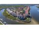 Aerial view of waterfront community with lush landscaping and boat slips at 460 Bouchelle Dr # 305, New Smyrna Beach, FL 32169