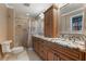 Bathroom with walk-in shower and granite-topped vanity at 460 Bouchelle Dr # 305, New Smyrna Beach, FL 32169