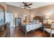 Guest bedroom with wood floors and ceiling fan at 460 Bouchelle Dr # 305, New Smyrna Beach, FL 32169