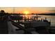 Private boat dock with multiple slips at sunset at 460 Bouchelle Dr # 305, New Smyrna Beach, FL 32169