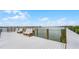 Relaxing seating area on a waterfront dock with water views at 460 Bouchelle Dr # 305, New Smyrna Beach, FL 32169