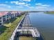Community boat docks extending along the waterfront at 460 Bouchelle Dr # 305, New Smyrna Beach, FL 32169