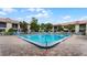 Inviting community pool with plenty of lounge chairs at 460 Bouchelle Dr # 305, New Smyrna Beach, FL 32169