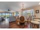 Bright dining area with hardwood floors and view of living room and water at 460 Bouchelle Dr # 305, New Smyrna Beach, FL 32169