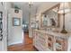 Bright and spacious entryway with hardwood floors and decorative console table at 460 Bouchelle Dr # 305, New Smyrna Beach, FL 32169