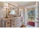 Entryway with rustic console table and balcony access at 460 Bouchelle Dr # 305, New Smyrna Beach, FL 32169