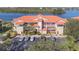 Exterior view of building with parking and waterfront location at 460 Bouchelle Dr # 305, New Smyrna Beach, FL 32169