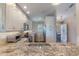 Modern kitchen with granite countertops and stainless steel appliances at 460 Bouchelle Dr # 305, New Smyrna Beach, FL 32169