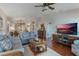 Comfortable living room with hardwood floors and views to kitchen and bedroom at 460 Bouchelle Dr # 305, New Smyrna Beach, FL 32169