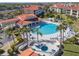 Resort-style pool and spa surrounded by lush landscaping at 460 Bouchelle Dr # 305, New Smyrna Beach, FL 32169