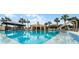 Community pool with a large sundeck and comfortable seating at 460 Bouchelle Dr # 305, New Smyrna Beach, FL 32169