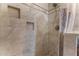 Walk-in shower with tiled walls and built-in niches at 460 Bouchelle Dr # 305, New Smyrna Beach, FL 32169