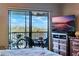 Waterfront view from bedroom, featuring a balcony and patio furniture at 460 Bouchelle Dr # 305, New Smyrna Beach, FL 32169