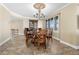 Elegant dining room features a large table, chandelier, and hardwood floors at 4621 S Atlantic Ave # 7101, Ponce Inlet, FL 32127