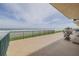 Spacious balcony overlooking the ocean with lounge chairs and stunning ocean views at 4621 S Atlantic Ave # 7101, Ponce Inlet, FL 32127