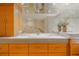 Modern bathroom with double sinks and wood cabinets at 4621 S Atlantic Ave # 7306, Port Orange, FL 32127