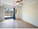 Bright dining area with hardwood floors, sliding doors to patio, and ceiling fan at 4623 Saxon Dr, New Smyrna Beach, FL 32169