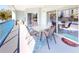 Relaxing balcony with outdoor seating and partial water view at 5300 S Atlantic Ave # 1-203, New Smyrna Beach, FL 32169