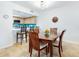 Kitchen and dining area with breakfast bar and wooden dining table at 5300 S Atlantic Ave # 1-203, New Smyrna Beach, FL 32169