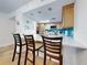 Updated kitchen with stainless steel appliances and teal tile backsplash at 5300 S Atlantic Ave # 1-203, New Smyrna Beach, FL 32169
