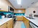 Modern kitchen with stainless steel appliances and teal backsplash at 5300 S Atlantic Ave # 1-203, New Smyrna Beach, FL 32169