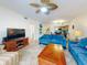 Open living area with comfortable seating and view into kitchen at 5300 S Atlantic Ave # 1-203, New Smyrna Beach, FL 32169