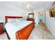 Main bedroom with king-size bed and ensuite bathroom access at 5300 S Atlantic Ave # 1-203, New Smyrna Beach, FL 32169