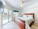 King-size bed in spacious main bedroom with private balcony access at 5300 S Atlantic Ave # 1-203, New Smyrna Beach, FL 32169