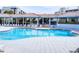 Resort-style pool with spacious deck and covered seating areas at 5300 S Atlantic Ave # 1-203, New Smyrna Beach, FL 32169
