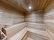 Relaxing cedar wood sauna with built-in bench seating at 5300 S Atlantic Ave # 1-203, New Smyrna Beach, FL 32169