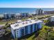 Oceanfront building with beach and neighboring buildings visible at 5300 S Atlantic Ave # 17-506, New Smyrna Beach, FL 32169