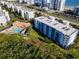 Aerial view of beachfront condo building with pool and ocean views at 5300 S Atlantic Ave # 17-506, New Smyrna Beach, FL 32169