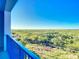 Private balcony with scenic nature views and boardwalk access at 5300 S Atlantic Ave # 17-506, New Smyrna Beach, FL 32169