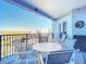 Private balcony with outdoor seating and scenic nature views at 5300 S Atlantic Ave # 17-506, New Smyrna Beach, FL 32169