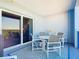 Private balcony with outdoor seating and scenic nature views at 5300 S Atlantic Ave # 17-506, New Smyrna Beach, FL 32169