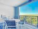 Private balcony with outdoor furniture and scenic view at 5300 S Atlantic Ave # 17-506, New Smyrna Beach, FL 32169