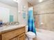 Updated bathroom with granite vanity, tiled shower/tub combo, and modern fixtures at 5300 S Atlantic Ave # 17-506, New Smyrna Beach, FL 32169